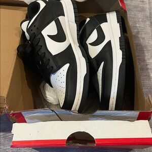 Nike Women’s low dunk Classic Black and White Sneakers